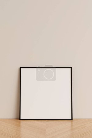 Foto de Limpia y minimalista vista frontal cuadrado negro foto o cartel marco maqueta apoyada contra la pared en el suelo de madera. renderizado 3d. - Imagen libre de derechos