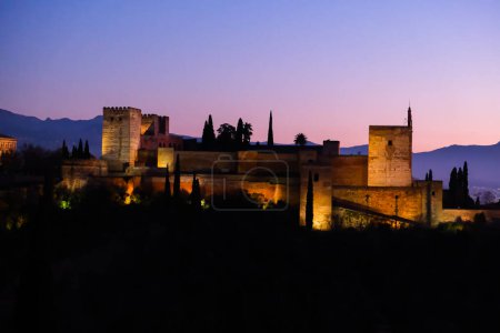 Granada, Spain. The Alhambra fortress and palace complex. Panoramic view in beautiful evening time. European travel landmark.