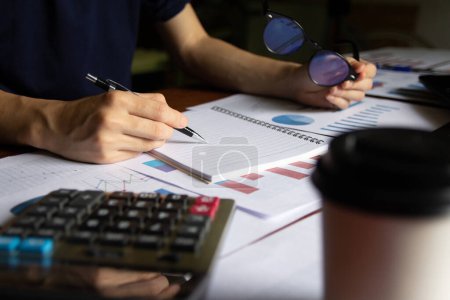 Photo for Writing report take note Chart on statistics data finance business Presentation to work communication online team of employees discussing financial statistics - Royalty Free Image