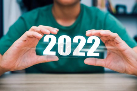 Foto de Feliz año nuevo 2022, la celebración de la mano 2022 empezar a nuevo año cambio de puntuación 2021 número de crecimiento celebración 2022 del año del zodíaco del tigre - Imagen libre de derechos
