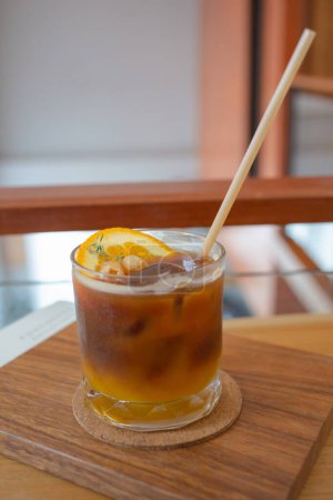 Photo for Refreshing iced coffee americano orange juice on the table - Royalty Free Image