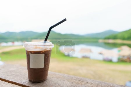 Asian summer drink, Delicious dark cocoa mockup empty logo blank space on the wood. The backdrop of the accommodation is relaxing, with tourist attractions, and natural reservoirs. leave space for you