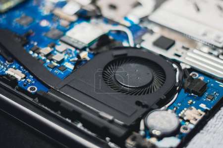 Photo for Internal components of notebook computers, laptops, cooling fans, repairs, cleaning of electronic devices. - Royalty Free Image