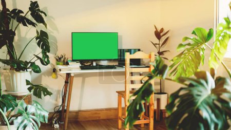 Photo for Desktop workspace with connect to laptop with HDMI cable split Green screen mock up monitor leaving space for text - Royalty Free Image