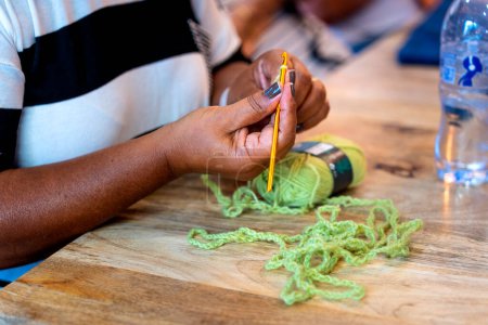 Photo for Crochet Club. Black skinned woman knitting - Royalty Free Image