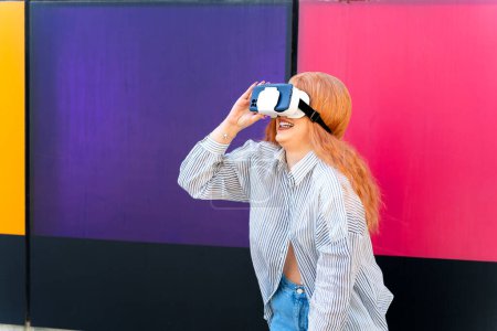 Redhead girl with virtual reality glasses