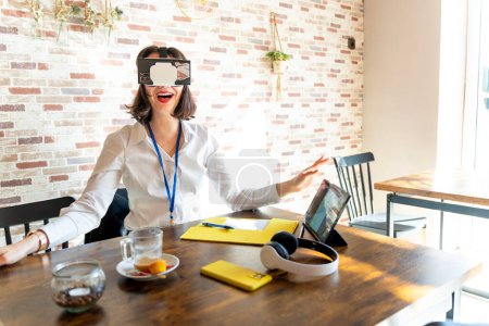 Photo for Business woman experiencing virtual reality for work. - Royalty Free Image