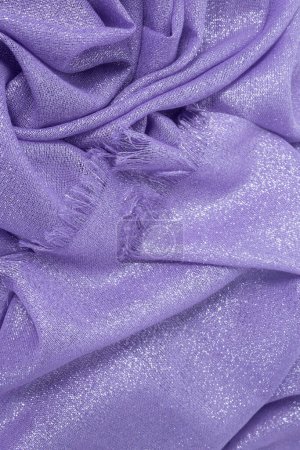 Texture of draped purple fabric with lurex