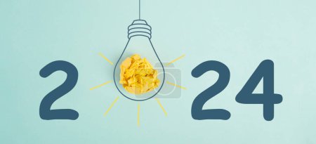 Photo for New Year 2024 with a light bulb, new idea, being innovative, starting a business, eduaction goal, resoltutions in progress - Royalty Free Image