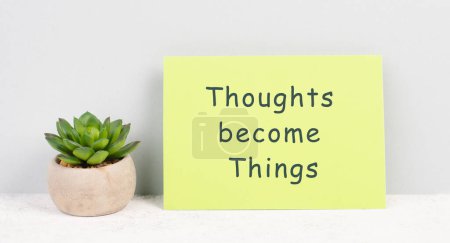 Photo for Thoughts become things is standing on a paper, positive thinking and motivation concept, belief in a vision - Royalty Free Image
