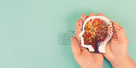Photo for Alzheimer awareness day, dementia diagnosis, Parkinsons disease, memory loss disorder, brain with autumn foliage - Royalty Free Image