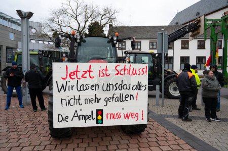 Photo for Farmer protest, denounce government plan for abolish agricultural diesel and vehicle tax exemptions, demonstration with tractors in the city of Trier, Germany on the 8.1.2024 - Royalty Free Image