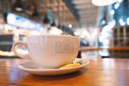 Photo for Cup of coffee in a cafe, hot drink with caffeine, breakfast in a restaurant, taking a break - Royalty Free Image