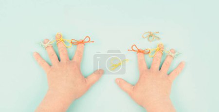 Photo for Alzheimer awareness day, dementia diagnosis, Parkinson disease, memory loss disorder, damaged brain, bow on finger as reminder - Royalty Free Image