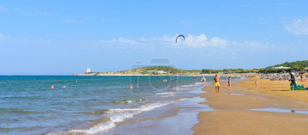 Photo for Vieste, Italy. View of the Scialmarino Beach with people on the beach and practicing water sports, on a Summer day, along the coast of Vieste. Banner header image. September 7, 2022 - Royalty Free Image