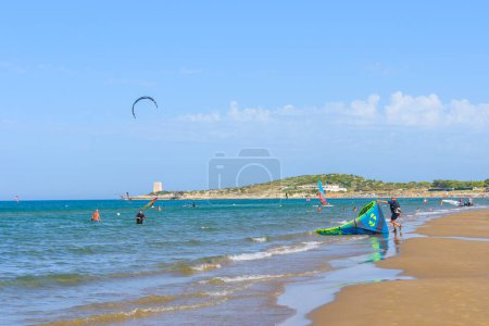 Photo for Vieste, Italy. View of the Scialmarino Beach with people practicing water sports, on a Summer day, along the coast of Vieste. September 7, 2022 - Royalty Free Image