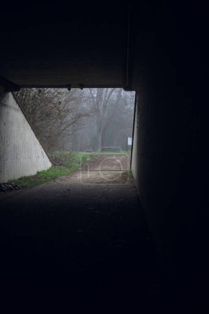 Tunnel in the shade on a foggy day