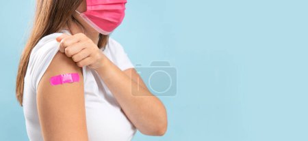 Photo for Young woman with protective mask after vaccination against coronavirus. Virus protection. COVID-2019. - Royalty Free Image