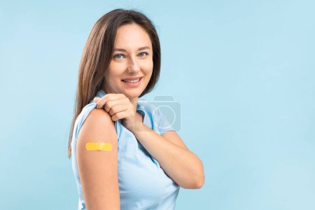Photo for Smiling young woman after vaccination against coronavirus. Virus protection. COVID-2019. - Royalty Free Image
