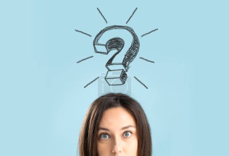Photo for Close up of a confused young woman standing on blue background with a large question mark above her hea - Royalty Free Image
