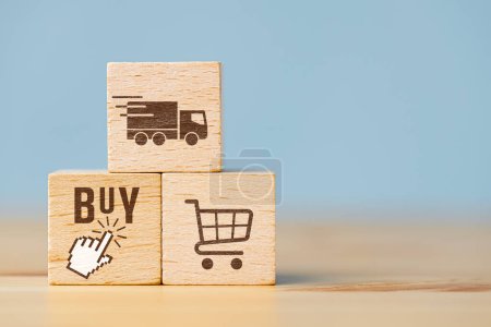 Photo for Wooden cubes showing symbols of online shopping and home delivery - Royalty Free Image