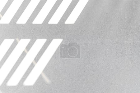 Photo for Diagonal sun reflections on a white wall, overlay effect for photo, mock-ups, posters, wall art, design presentation - Royalty Free Image
