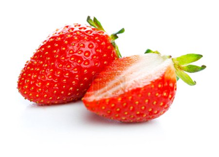 Photo for Strawberries on isolated white background. Strawberry slice and whole berry. Two strawberries on white - Royalty Free Image