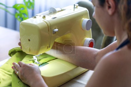 Photo for Cropped shot of an unrecognizable woman making a garment at hom - Royalty Free Image