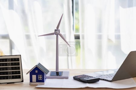 Photo for Wind turbines and solar cells. House on the table. Renewable energy concept. - Royalty Free Image