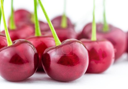 Photo for Fresh cherry, red cherry on a green stem. - Royalty Free Image
