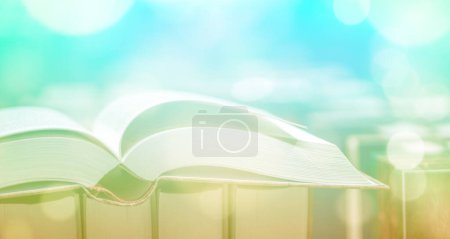 Photo for Open book close-up, blurred light background. Copy space. - Royalty Free Image