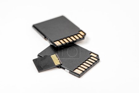 Photo for Close-up of black memory cards on a white background. SD memory card to use when taking pictures on your digital camera. - Royalty Free Image