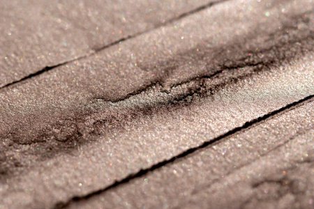 Foto de Manchado textura de polvo bronceado marrón con movimientos aleatorios. Fondo abstracto. - Imagen libre de derechos