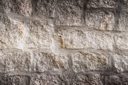 Téléchargez les photos : Old stone wall background. Closeup front view of dark stone wall texture - en image libre de droit
