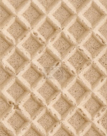 Sweet dessert background. Empty wafer texture. Detail texture of golden waffle. Top view with space for text
