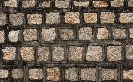 Photo for Stone wall textured background. Dark brown and beige bricks have textured and uneven shapes - Royalty Free Image