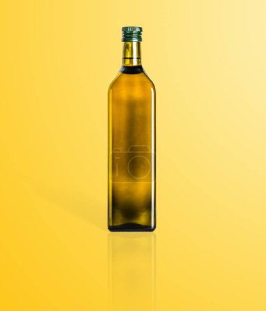 Photo for Olive oil glass bottle in oil background close up - Royalty Free Image