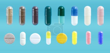 Medical pills and capsules set, on blue background. Pharmaceutical painkiller drugs.