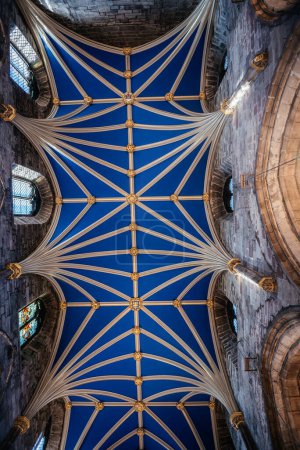 The detailed and ornate blue ceiling of St. Giles Cathedral, featuring Gothic architecture and intricate design elements