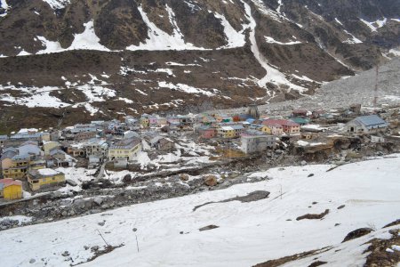 Photo for Kedarnath Dham, Kedarpuri, Kedar Nagri covered in Snow. Kedarnath is a town in the Indian state of Uttarakhand and has gained importance because of Kedarnath Temple. High quality photo - Royalty Free Image