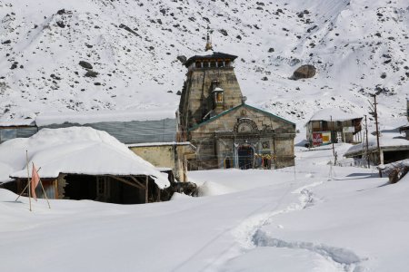Photo for Kedarnath temple, shrine covered with snow. Kedarnath temple is a Hindu temple dedicated to Shiva. Located on the Garhwal Himalayan range near the Mandakini river. - Royalty Free Image