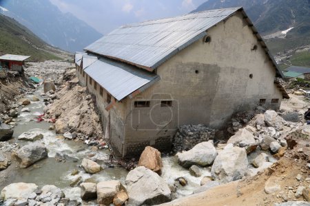 Photo for Damaged building, pathway, sheds in Kedarnath disaster India. Kedarnath was devastated on June 2013 due to landslides and flash floods that killed more than 5000 people in Uttarakhand. - Royalty Free Image