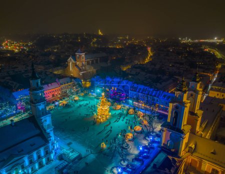 Photo for Aerial photo of Kaunas Christmas tree and Christmas town in a city hall square. 2022-2023 winter. Kaunas every year presents unique Christmas tree, this year its called - Stars Trails. - Royalty Free Image