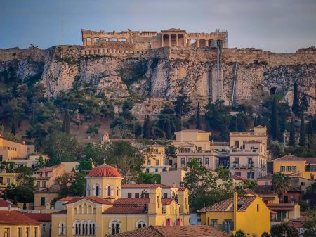 Photo for The Acropolis of Athens in Greece. Zoomed panoramic view with the Parthenon Temple on top of the hill during a summer sunset - Royalty Free Image