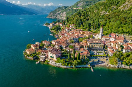 Photo for Menaggio, Como Lake. Aerial panoramic view of town surrounded by mountains, blue sky and turquoise water and located in Como Lake, Lombardy, Italy - Royalty Free Image