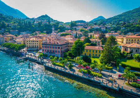 Photo for Menaggio, Como Lake. Aerial panoramic view Menaggio town surrounded by mountains and located in Como Lake, Lombardy, Italy - Royalty Free Image