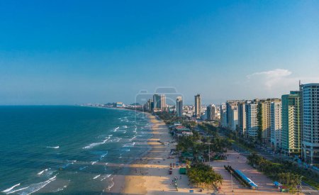 Photo for Aerial sunset view of Da Nang coastline. My Khe beach seafront with high-rise hotels and skyscrapers in the golden sand beach - Royalty Free Image