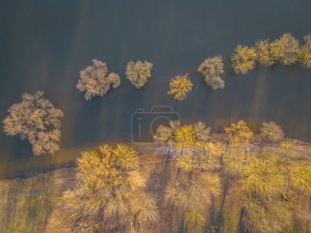 Aerial view of spring flood in the middle of the city. Covered embankments, trees in Kaunas old town, Lithuania