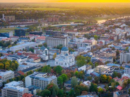 Aerial landscape view of Kaunas new city center with sobor in middle during a sunset.