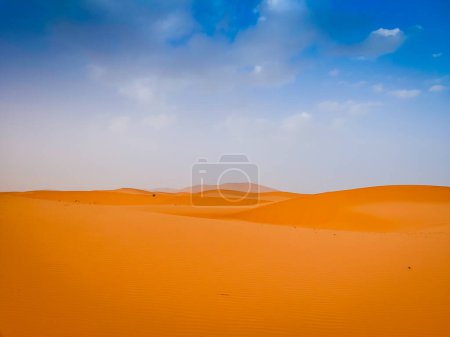 Sand dunes in the Sahara desert with blue sky in background, Merzouga, Morocco, North Africa